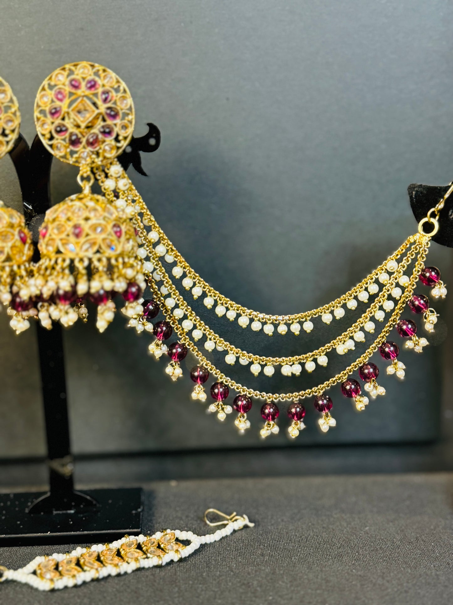 Beautiful Bahubali jhumki with tikka in gold and red for wedding and any other occasion