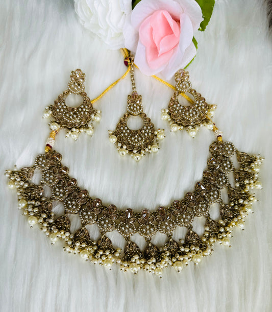 Beautiful golden white pearl necklace earring tikka set